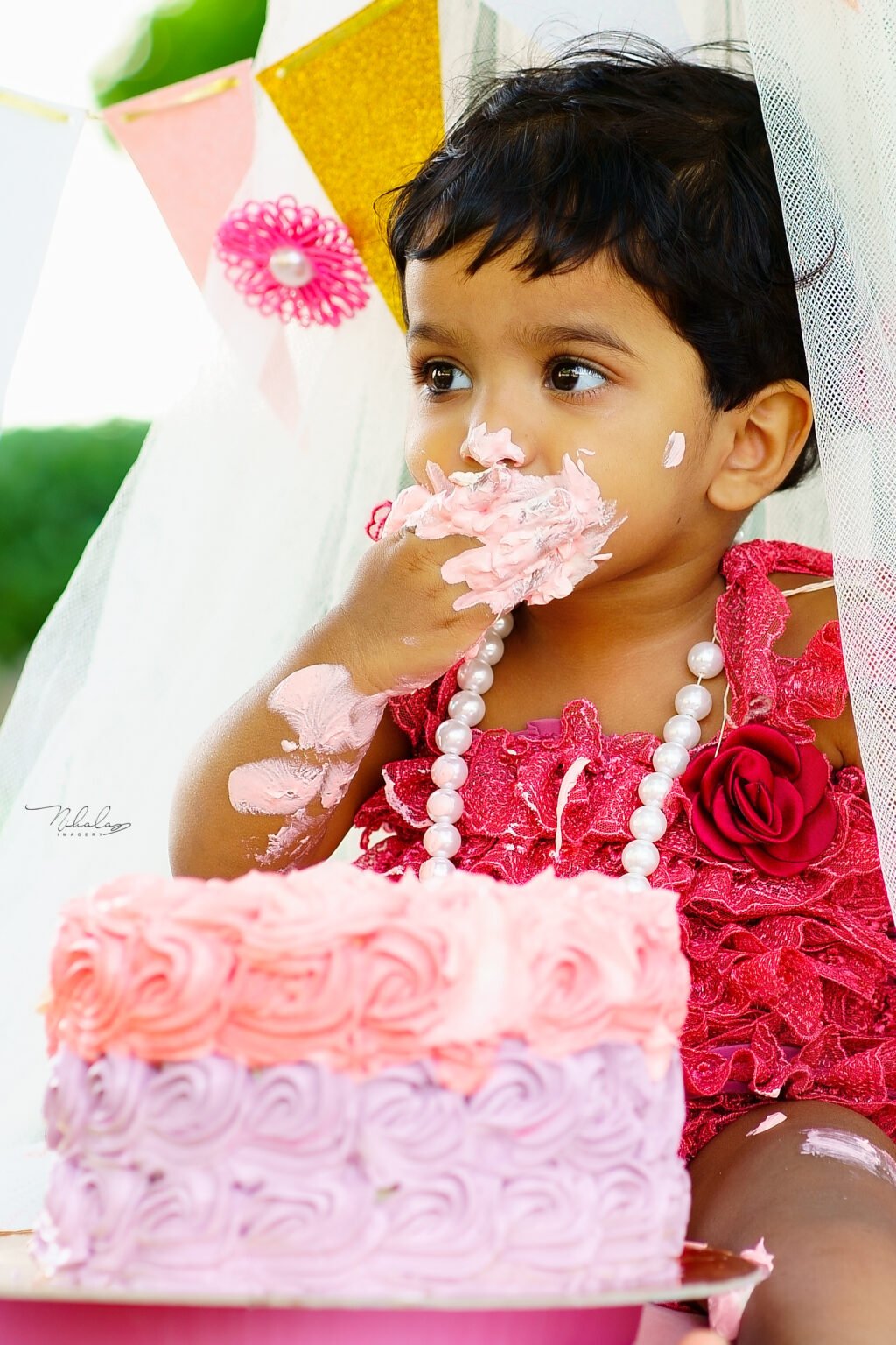 Child’s first birthday cake smash photographed in Qatar