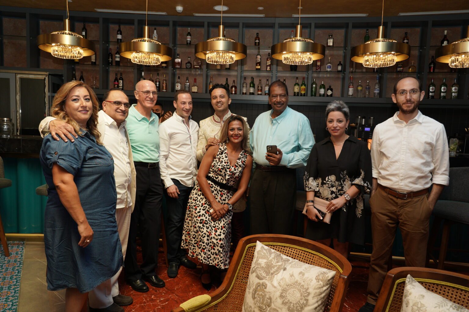Group photo at a corporate dinner event in Doha