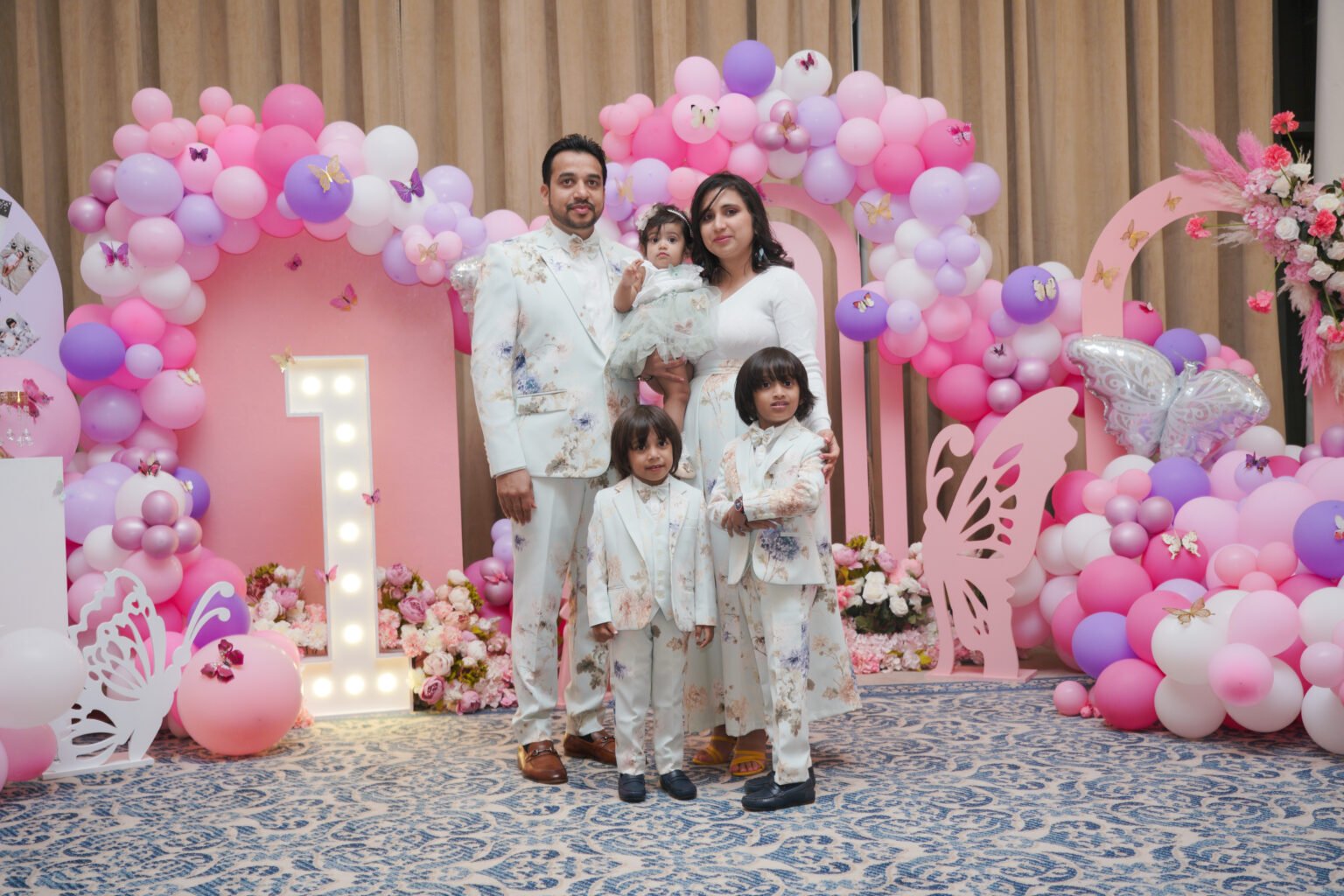 Family portrait at a birthday celebration in Doha